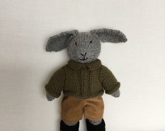 Handmade grey knitted bunny , mid green jumper , mustard cords and black shoes.