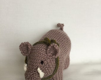 Mid brown wild boar pig piggy with tusks and green scarf.