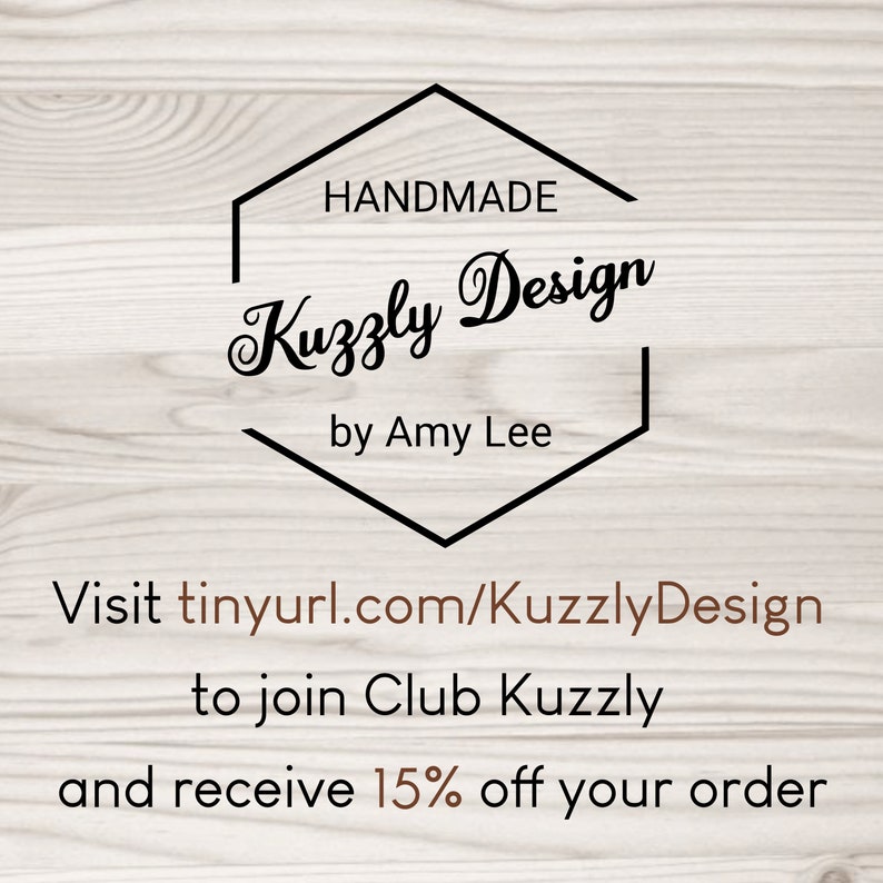 May include: A logo with the text "HANDMADE Kuzzly Design by Amy Lee" inside a black hexagon shape. Below, the text "Visit tinyurl.com/KuzzlyDesign to join Club Kuzzly and receive 15% off your order" is displayed.