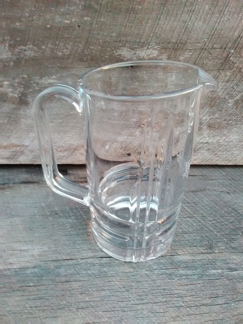 Inv.#865 Vintage Clear Pressed Glass Design Beer Pitcher With A White Swan Motif