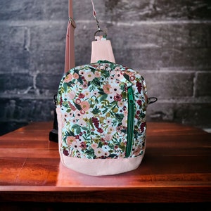 Sling bag converts to crossbody purse, roomy purse with front zipper pocket and interior pocket.