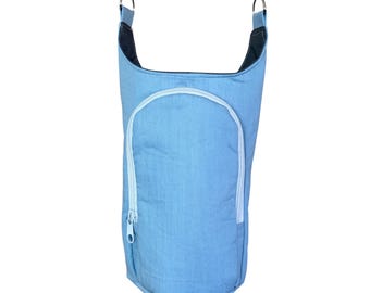 May include: Light blue sling bag with a white zipper and a white strap. The bag has a cylindrical shape with a front pocket and a zipper closure. The strap is attached with metal clasps.