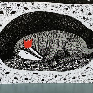 May include: A black and white illustration of a badger wearing a red crown, sleeping in a cave with a starry night sky above.