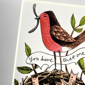 Digital Print in 10”x8” white mount. Robin mum being given the worm by her chicks.