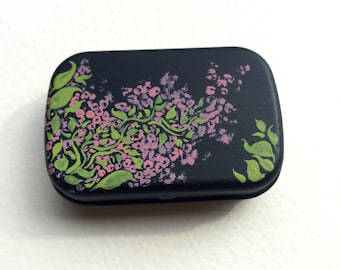 Small metal mint tin painted with pink acrylic floral designs and patterns perfect for stocking stuffer Christmas present holiday gift art