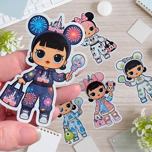 May include: A collection of colorful stickers featuring cartoon dolls in various outfits. The dolls have large eyes and are wearing outfits with Disney themes, including fireworks, castles, and character-themed clothing. Each doll is holding accessories like bags and wands.