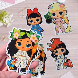 May include: A collection of four die-cut vinyl stickers featuring stylized cartoon characters with large eyes. The designs include characters inspired by Moana, Rapunzel, and Dory, wearing matching crop top and pant sets with various character-themed prints.