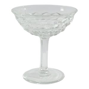 vintage glass is a Fostoria American Clear Champagne/Tall Sherbet Glass (also known as a comport or candy dish), featuring the iconic "Ameri
