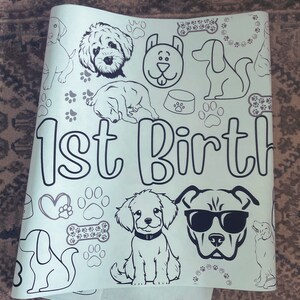 May include: A white coloring page with a black and white illustration of dogs, bones, paw prints, and the text "1st Birth".
