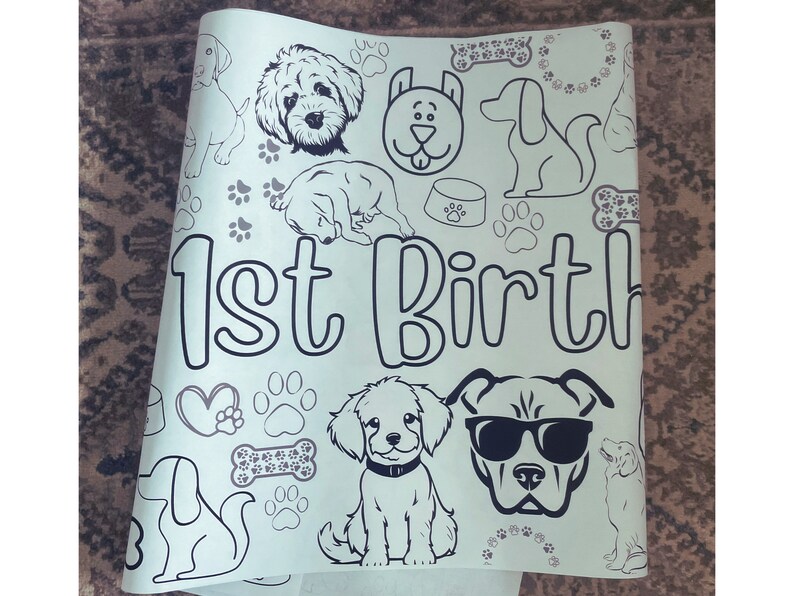 May include: A white coloring page with a black and white illustration of dogs, bones, paw prints, and the text "1st Birth".