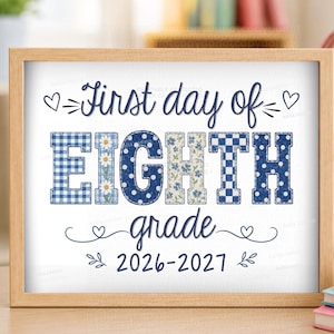 May include: A rectangular wooden frame containing a white sign with the dark blue text First day of EIGHTH grade 2026-2027. The letters in EIGHTH feature various blue and white patterns including gingham, polka dots, and floral prints.