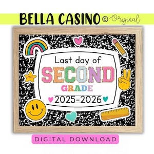 May include: A framed print with the text "Last day of SECOND GRADE 2025-2026". The print has a black and white composition notebook paper background and colourful stickers including a rainbow, star, heart, pencil, peace sign, smiley face, and ruler.