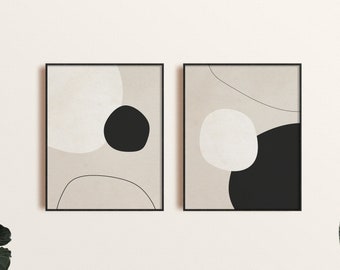 May include: Two framed abstract art prints with a beige background and black and white geometric shapes.