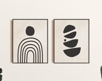Puede incluir: Dos impresiones de arte abstracto en blanco y negro con un diseño minimalista. La impresión de la izquierda presenta un círculo y una forma de arcoíris. La impresión de la derecha presenta una pila de círculos superpuestos.