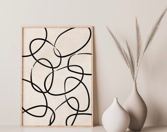 May include: A framed print with a minimalist abstract design featuring black lines forming overlapping circles on a beige background.