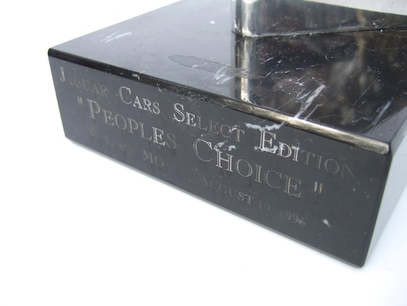 Sleek Jaguar Chrome Plated Hood Ornament on Black Marble Pedestal