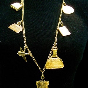 Opulent Gilt Metal Travel Theme Charm Necklace