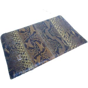 May include: A brown and black snakeskin clutch purse with a silver logo.