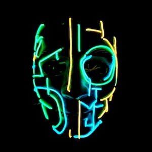 May include: A glowing mask with neon green and yellow outlines against a black backdrop. The mask's design features a face shape with eye and mouth openings. The neon lights create a futuristic or electronic aesthetic.