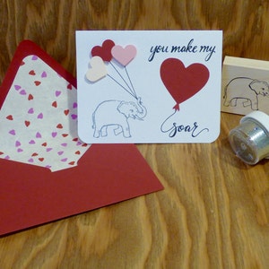 Tarjeta de amor con elefantes para San Valentín