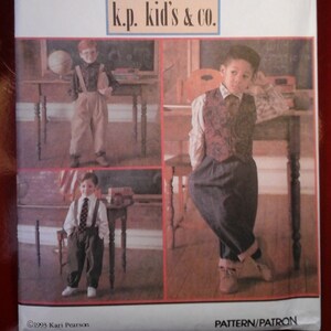 May include: Simplicity sewing pattern 8567 for kids' clothing. The pattern includes instructions for making three different outfits: a vest and pants, a shirt and pants, and a shirt and overalls. The pattern is for sizes 5-8.