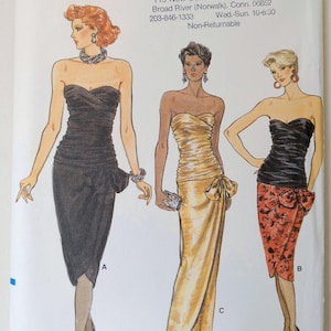 May include: Vogue Patterns sewing pattern featuring three strapless evening gowns. The illustrations show a black, gold, and black and red floral design. The pattern number is 9441, size 8.