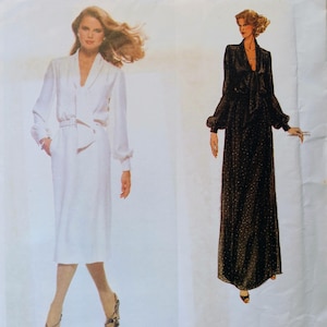 May include: Vogue Paris Original sewing pattern featuring two Pierre Balmain designs. One is a white dress with a belt, and the other is a black dress with a bow and polka dots. The pattern number is 1857.