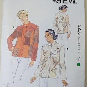 May include: A Kwik Sew pattern envelope 3236 for a jacket with a mandarin collar and button front. The illustration shows two jacket variations, one in orange and brown tones and one in cream and beige with floral embroidery details.