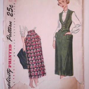 May include: Vintage sewing pattern for a skirt and vest. The pattern is printed on a white paper with a red and black plaid skirt and a green vest. The pattern number is 2938, the size is 10, and the bust is 28. The pattern is 25 cents.