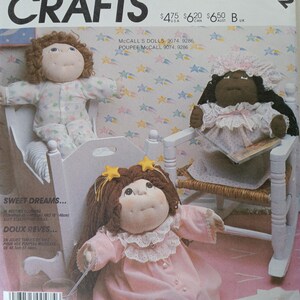 May include: A sewing pattern for making three Cabbage Patch Kids dolls. The pattern is called "Sweet Dreams..." and includes instructions for making a doll with brown hair, a doll with black hair, and a doll with blonde hair. The pattern is from McCall's Crafts and is number 2242.