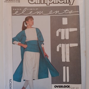 May include: Simplicity sewing pattern for a long teal cardigan, white top, and white pants. The pattern includes instructions for using an overlock or serger machine. The pattern number is 8726.