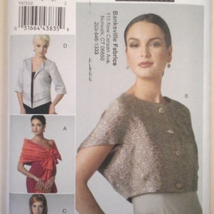 May include: A sewing pattern for a short-sleeved jacket with three different styles. The pattern is from Vogue Patterns and is for size Z (Large-Extra Large). The pattern is for accessories and is called V8721.
