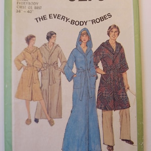 May include: Vintage Simplicity sewing pattern 8275, featuring illustrations of robes in various styles. The pattern includes the text "LARGE EVERYBODY CHEST OR BUST 38"-40"" and "THE EVERY-BODY ROBES". The cover is green and white.