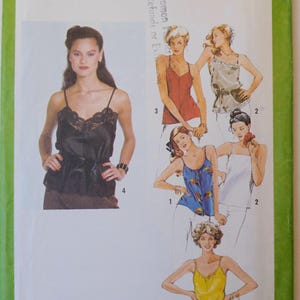 May include: Simplicity pattern 9296 featuring various women's tops. The image shows a black camisole with lace trim, and other tops in red, blue, white, and yellow. The pattern includes the text "SIZE 10 MISS".