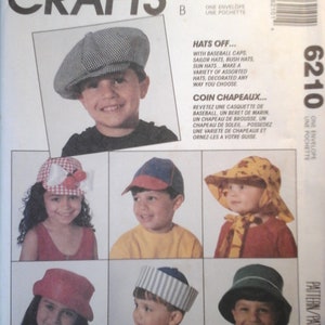 May include: A sewing pattern for making hats for children. The pattern includes instructions for making baseball caps, sailor hats, bush hats, and sun hats. The pattern is called "Hats Off..." and "Coin Chapeaux..." and is from McCall's Crafts.