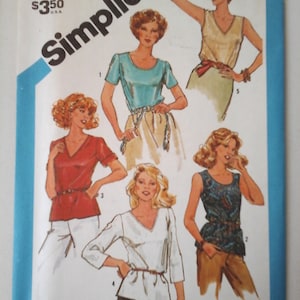 May include: A sewing pattern for a women's blouse with a variety of neckline and sleeve options. The pattern includes five different styles, including a sleeveless top, a short-sleeved top, and a long-sleeved top. The pattern is from Simplicity and is size 10 miss.
