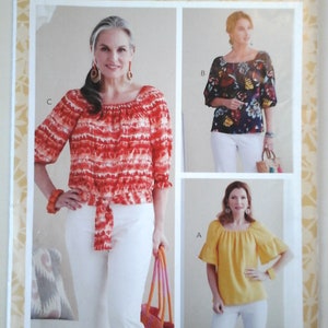 May include: A sewing pattern for a women's blouse with three different styles. The pattern is from Butterick and has the number R10632. The blouse has a square neckline and short sleeves. The three styles are a red and white tie-dye blouse, a blue and white floral blouse, and a yellow blouse.