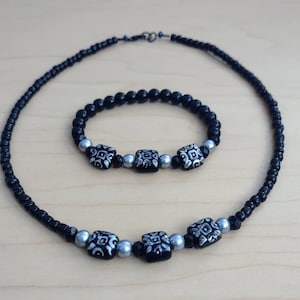 Matching Jet Black and Silver Bracelet and Choker Necklace Jewelry Set for a Woman.