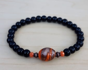 Orange and Gold Center Stone Stretch Bracelet with 6mm Black Onyx Pearls.