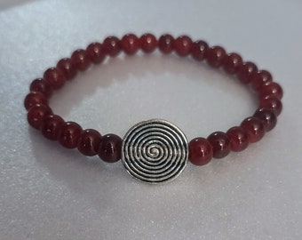 Garnet Wine Color Jasper Bead Stretch Bracelet with a Silver Spiral Center Bead for a Woman.