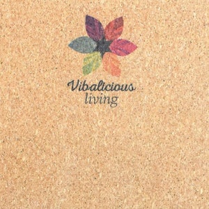 May include: A corkboard with a colorful flower design and the text "Vibalicious living" in the center.