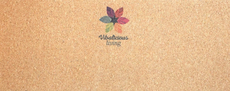 May include: A corkboard with a colorful flower design and the text "Vibalicious living" in the center.