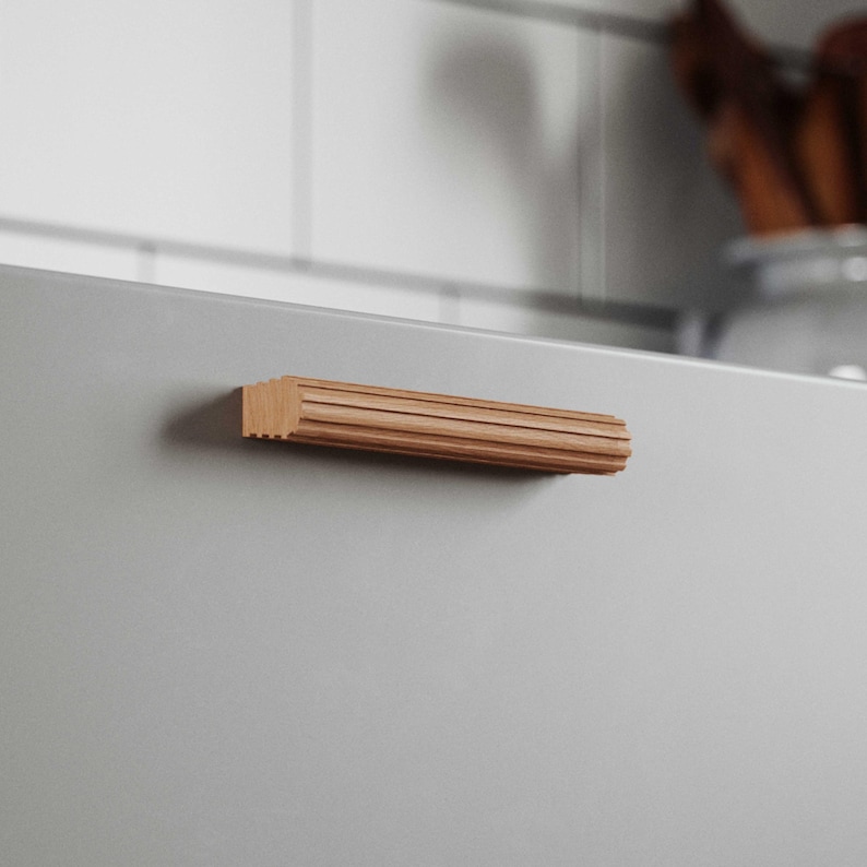 ribbed wood drawer pull, beech wood, rowzec design, installed on a grey drawer
