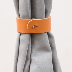 Curtain holdback with wall attachment / Curtain tieback from leather
