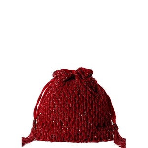 May include: A red beaded drawstring bag with a tassel on each side.