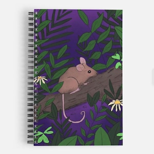 May include: Spiral-bound notebook featuring a whimsical illustration of a brown mouse perched on a log amidst lush green foliage and white flowers against a deep purple background. The notebook has a silver spiral binding.