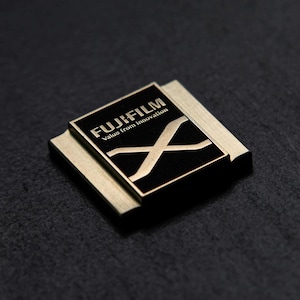 Piastra/tappo slitta Fuji / Fujifilm “X” (colore rame)
