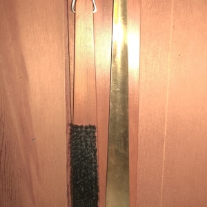 Vintage Echt Nussbaum shoehorn and brush hanging set