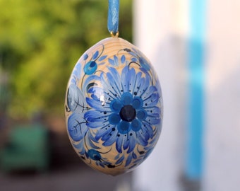 Unique Easter eggs finely painted with a floral blue ornament, traditional handmade hanging Easter egg decorations with Petrykivka painting