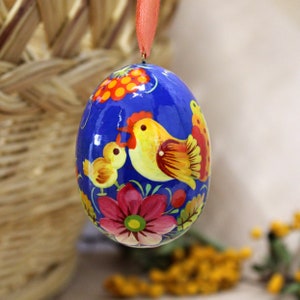 Ukrainian Pysanka egg with chick and chicken, wooden hand painted according to the ukrainian traditions of Petrykivka-painting